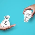 Two hands against a blue background: one holds a paper cutout of a money bag with a dollar sign, and the other holds a lightbulb, representing exchanging money for ideas—highlighting Online Reputation Management costs.