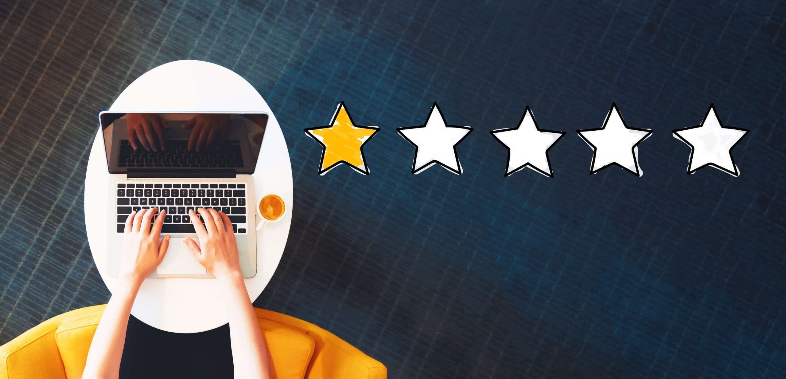 A person using a laptop for online reputation management with five stars on it.