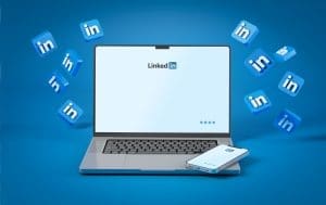 Linkedin logos surrounded by a laptop and phone.