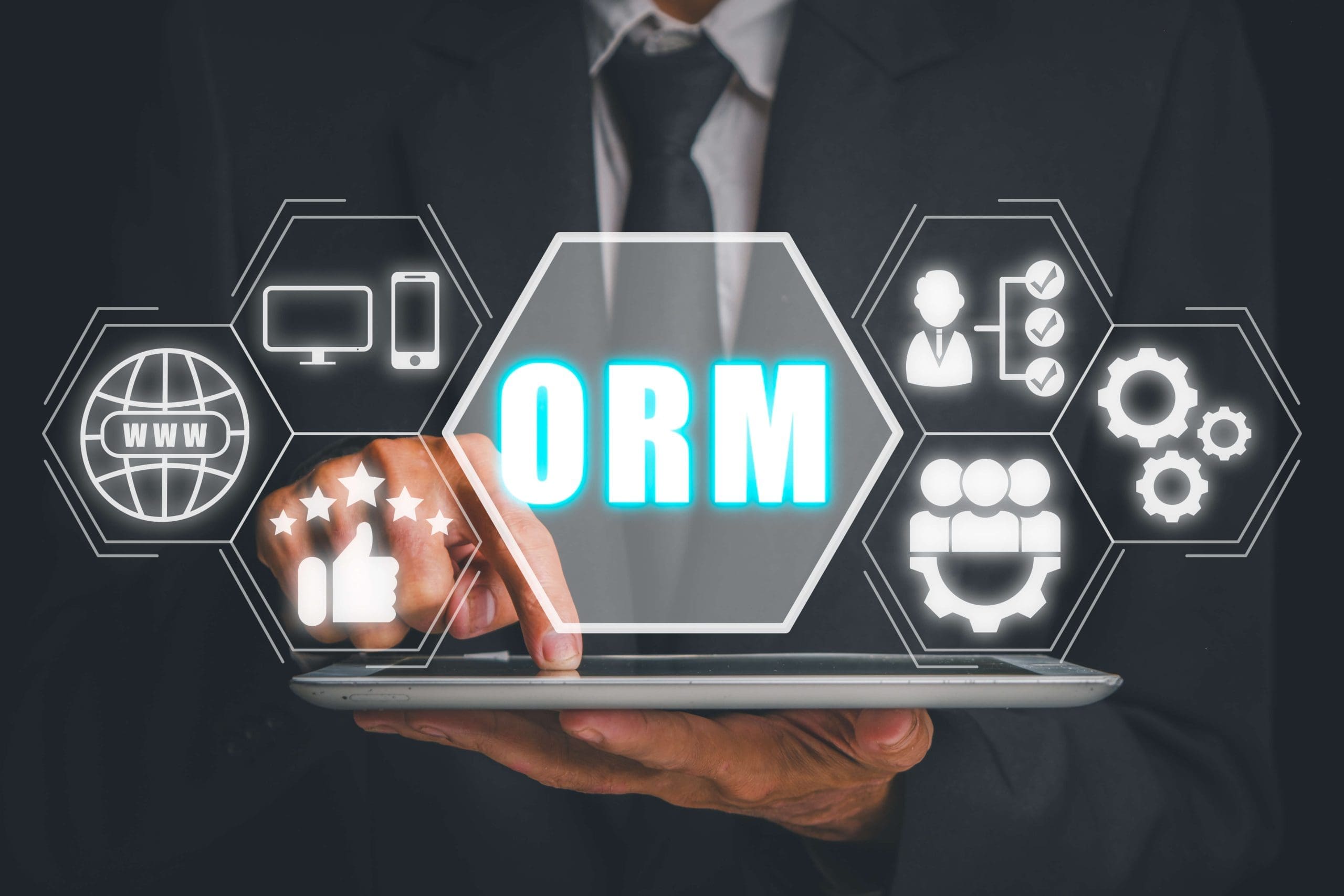 A businessman holding a tablet featuring an online reputation management (ORM) platform.
