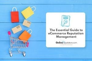 A shopping cart with gift boxes next to a guidebook for ecommerce reputation management on a blue wooden background.