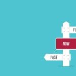 A signpost with arrows pointing left to "PAST," right to "FUTURE," and a red sign in the center reading "NOW," set against a plain blue background.