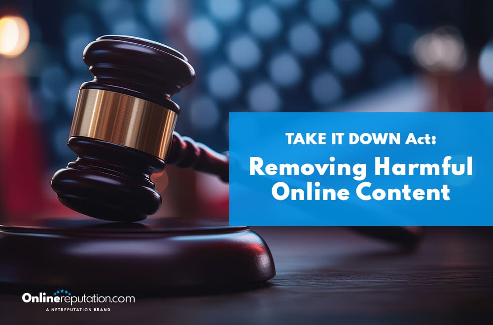 A judge’s gavel sits beside a blue sign that reads, "TAKE IT DOWN Act: Removing Harmful Online Content," highlighting the take it down act. The logo at the bottom says "OnlineReputation.com"; blurred lights fill the background.
