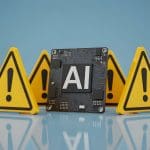 A computer chip labeled "AI" stands surrounded by five yellow warning signs with exclamation marks on a blue background, suggesting caution or potential risks related to artificial intelligence.